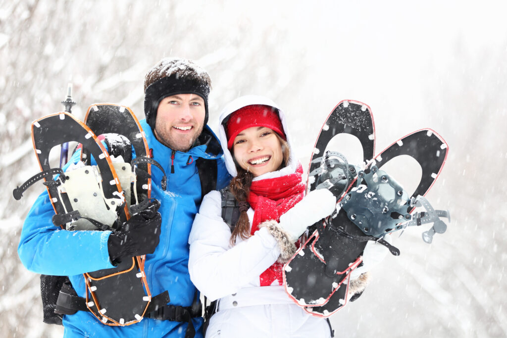 Couple snowshoeing in Vancouver with rented snowshoe gear from YesCycle